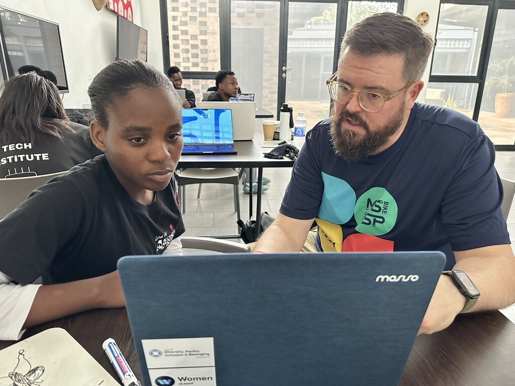 MCRI student and instructor working together at a laptop